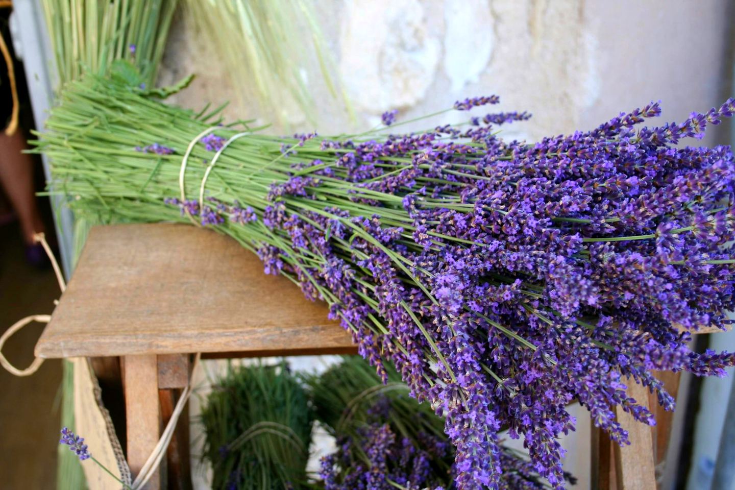 Bunches of fresh lavender on a wooden stool